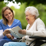 Young CNA providing assistance to elderly patient