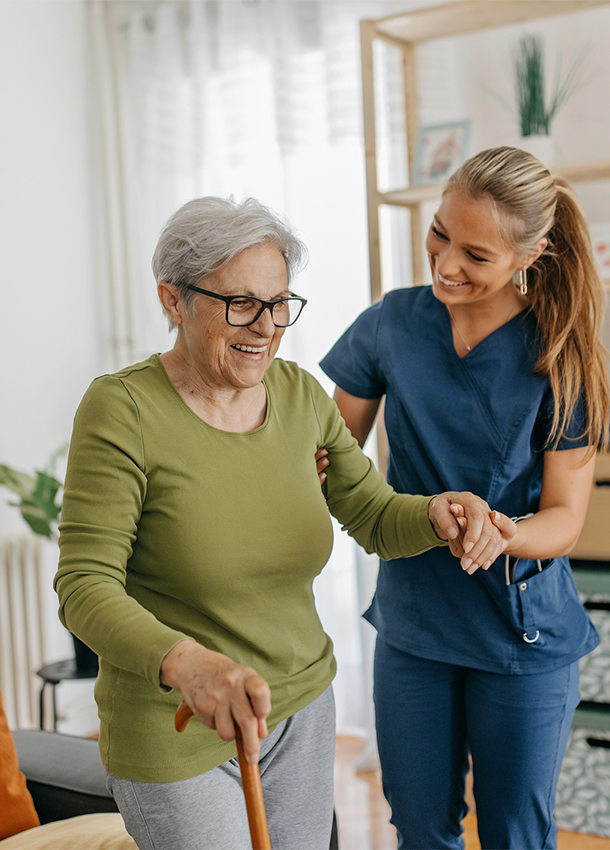 Angels of Serenity aide helping elderly client and offering compassionate care.